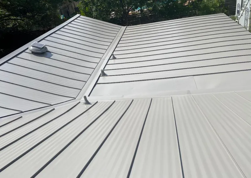 Solar attic fan installed on a metal roof for Roof Ventilation in North Myrtle Beach